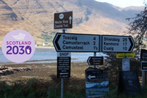 View of signposts pointing in different directions on Applecross